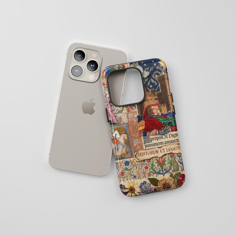 a silver iPhone with a colorful, ornate case on top of it.