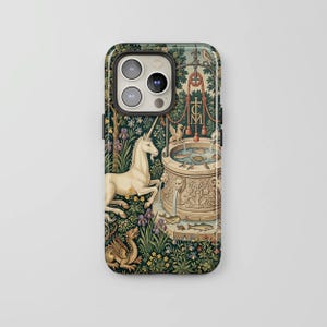 May include: A phone case featuring a detailed tapestry design with a unicorn, dragon, and well. The case has a dark green background with floral and foliage elements. The artwork includes a well with water, a bird, and a red rope.