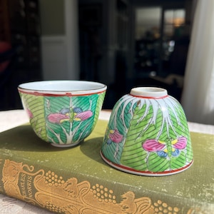 May include: A set of three ceramic mugs with a speckled, matte finish. The mugs are in shades of cream, light gray, and dark gray. Each mug has a simple, minimalist design, perfect for coffee or tea.