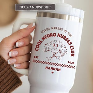 May include: White travel mug with a handle, featuring a maroon graphic that reads "Cool Neuro Nurses Club" with a cartoon brain character. The mug also includes the name "Hannah" and the year "2023". The text "Neuro Nurse Gift" is at the top.