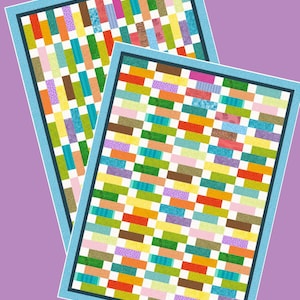 May include: Two colorful quilts with a patchwork design. Each quilt features a rectangular pattern of various colored fabric strips, including orange, green, purple, and yellow. The quilts are framed with a blue border.