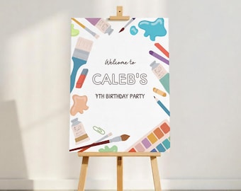 May include: Welcome to Caleb's 7th Birthday Party sign with a white background and colorful art supplies like paintbrushes, paint tubes, and a paint palette.