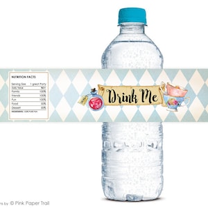 May include: A blue and white water bottle label with a whimsical design featuring a teacup, a bottle with a red liquid, and the text "Drink Me".