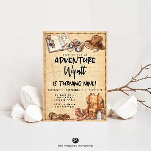 May include: An invitation with a vintage adventure theme. The text reads "Join us for an Adventure Wyatt is Turning Nine!" with details for the party. The design includes a compass, map, binoculars, hat, backpack, boots, and rope.