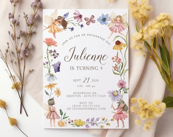 May include: A whimsical invitation for Julienne's 4th birthday, featuring watercolor illustrations of fairies and flowers. The text reads "Join us for an enchanted day" and includes event details. The design is framed by a floral border, with the text "Party Printables by Pink Paper Trail" at the bottom.