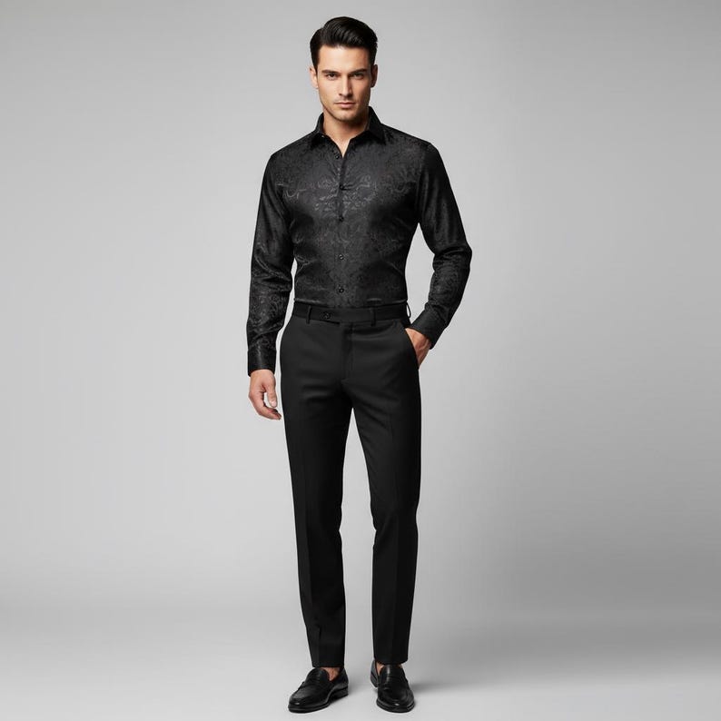 May include: A black long-sleeve button-down shirt with a subtle floral pattern, paired with black dress pants and black leather shoes. The outfit is a classic, formal ensemble.