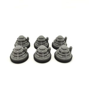 May include: Six gray, miniature, tiered structures with a rounded top and a black base are arranged on a white background. Each structure has a detailed, architectural design, suggesting a model or decorative item.