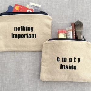 Witty zip pouches : Nothing or Empty multipurpose screen printed purse