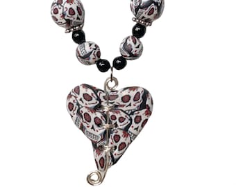 Goth heart broken heart pendant necklace, white black and red skulls and roses, long beaded necklace, a distinctive ooak gift charity aid