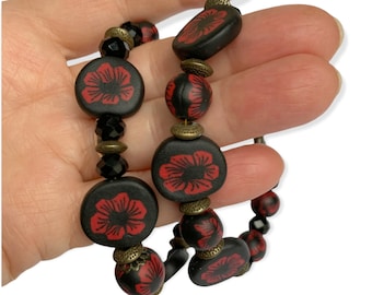 Jet black and red beaded bracelet, handmade ceramic goth fashion festival bracelet, unisex emo hippy funky jewellery gift, not for profit