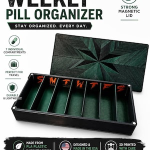 May include: A rectangular 7-day weekly pill organizer with a black exterior and dark green interior. The lid features a geometric star pattern. Inside, seven compartments are labeled with red letters S, M, T, W, T, F, S. The lid uses a magnetic closure.