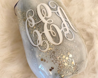 Personalized 15 ounce white and silver marbled glitter tumbler with sliding lid and straw included.