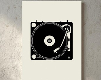 May include: Black and white graphic print of a turntable on a cream-colored background. The turntable is square with a circular record and a tone arm. The print is displayed on a wall, with a wooden chair and a lamp in the background.