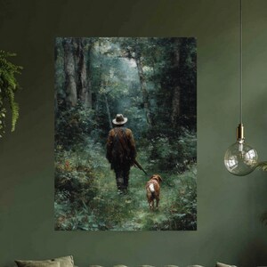 May include: A framed artwork depicts a person and a dog walking through a forest. The person is wearing a hat and carrying a rifle. The dog is brown and white. The artwork is displayed above a green tufted sofa and a wooden trunk coffee table.