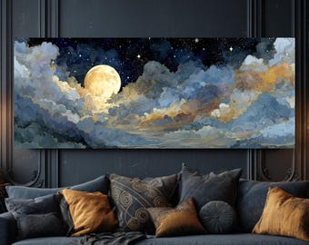 May include: A rectangular canvas print showcases a night sky with a large, luminous moon peeking through blue and gold-toned clouds. The artwork hangs above a blue sofa with cushions, creating a celestial-themed living space with a cosy atmosphere.