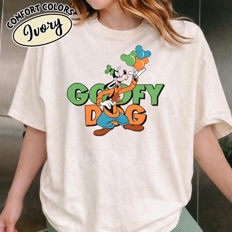 May include: A white ceramic mug with a black handle and the text "But First, Coffee" in a black, handwritten-style font. The mug is on a white surface.