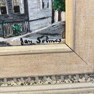 May include: A close-up of a painting's signature, "Jan Solmes", in black ink on a white canvas.