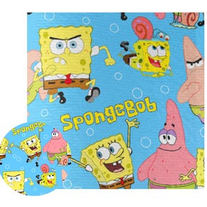 May include: A light blue fabric featuring a repeating pattern of the cartoon character SpongeBob SquarePants and his friend Patrick Star. The word "SpongeBob" is printed in yellow. The design includes bubbles.
