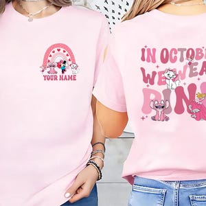 Custom Pink Characters In October We wear Pink For Breast Cancer Awareness T-Shirt, Disneyland Pink Ribbon Shirt, Breast cancer warrior gift