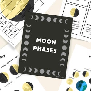 May include: A collection of educational cards featuring illustrations of moon phases. The central card is black with the words "MOON PHASES" in white. The cards also include diagrams of the moon's different phases and related text.