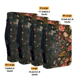 May include: Four floral-patterned tote bags in varying sizes, each with a black handle. The bags feature a dark green background with a floral design in pink, yellow, and white. The text "Be Still And Know" is visible on one bag. Sizes range from 9.2x6.3x1.6 inches to 12x9x2.4 inches.