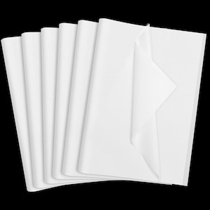 May include: A stack of multiple rectangular sheets of thin, semi-translucent white tissue paper. The sheets are layered and fanned out, with the top right corner of the uppermost sheet folded over to reveal the texture and opacity of the paper.