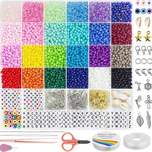 May include: A comprehensive craft kit featuring a multi-compartment organizer filled with assorted colorful glass seed beads, alphabet letter beads, heart beads, and eye beads. Includes metal charms, seashells, lobster clasps, jump rings, needles, tweezers, scissors, and two spools of elastic string.