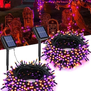 May include: Two sets of solar-powered string lights featuring alternating purple and orange LED bulbs on black wire. Each set includes a rectangular solar panel attached to a black plastic ground stake for outdoor installation and illumination.