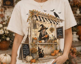 女性用パンプキンポーションシャツ、魔女マーケットTシャツ、パンプキンシーズンTシャツ、居心地の良いハロウィンギフトTシャツ、魔女風秋シャツ、秋の魔女ギフトTシャツ