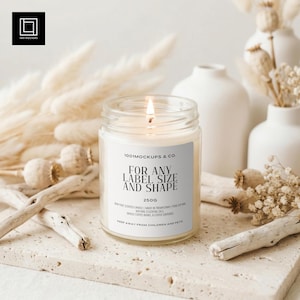 May include: A burning glass jar candle with a white label. The label reads "FOR ANY LABEL SIZE AND SHAPE" and "250G". The candle is set amongst neutral-toned decor, including dried flowers and white vases.
