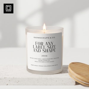 May include: A lit, frosted glass candle with a wooden lid. The candle has a white label with the text "FOR ANY LABEL SIZE AND SHAPE" and "250G". The candle is on a white surface.