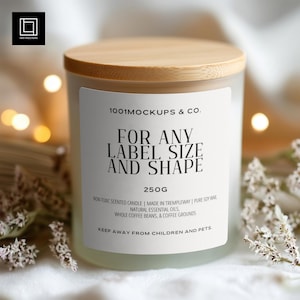May include: A frosted glass candle with a wooden lid. The label reads "FOR ANY LABEL SIZE AND SHAPE" and "250G". The candle is surrounded by soft lighting and delicate flowers. The candle is made with natural essential oils and whole coffee beans.