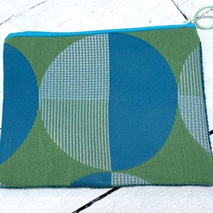 one of a kind / mod / mcm / pouch / bag / travel bag  / cosmetic bag / chargers / cord carrier / zipper bag / zipper pouch / coin purse