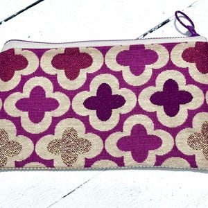 one of a kind / quartrefoil  / pouch / bag / travel bag  / cosmetic bag / chargers / cord carrier / zipper bag / zipper pouch / coin purse
