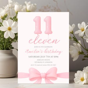 May include: A pink birthday invitation with the number 11 as balloon shapes. The word "eleven" is written in cursive, with the text "Join us to celebrate Amelia's birthday" below. A pink bow is at the bottom.