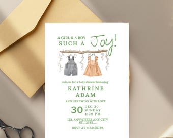 Może przedstawiać: Zaproszenie na baby shower z tekstem "A GIRL & A BOY SUCH A Joy!" z akwarelowymi ilustracjami ubranek dla dzieci. Zaproszenie zawiera imię "KATHRINE ADAM" i szczegóły wydarzenia. Zaproszenie jest na białym papierze ze złotą kopertą.