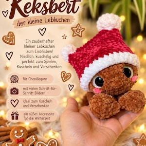 Puede incluir: Un peluche de ganchillo marrón con forma de pan de jengibre, ojos negros grandes y mejillas rosas, que lleva un gorro rojo y blanco con pompón. El texto Keksbert der kleine Lebkuchen es visible junto a iconos de hilo, cámara, corazón y regalo.