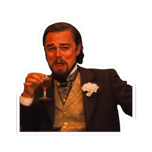 May include: A sticker featuring a man in a formal suit, holding a glass of red liquid, with a distressed expression. The man is wearing a dark brown suit jacket, a cream-colored vest, and a white flower on his lapel. The image is a meme.