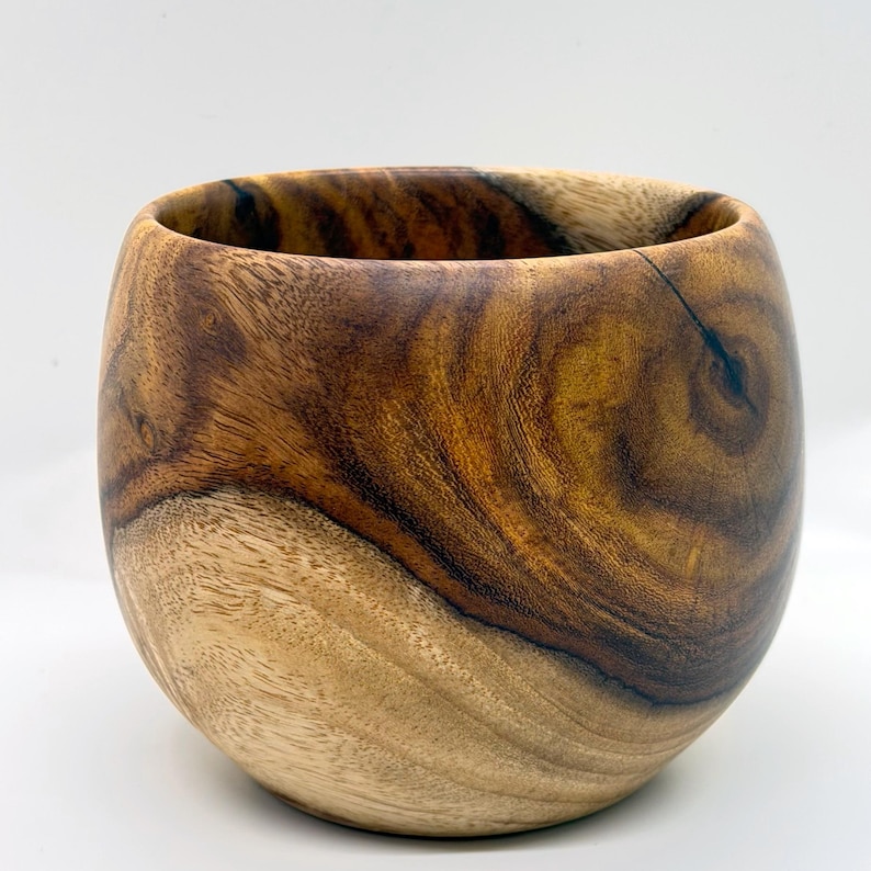 Hand-turned rosewood bowl, cream sapwood sweeping into olive-gold and chocolate heartwood with figured grain