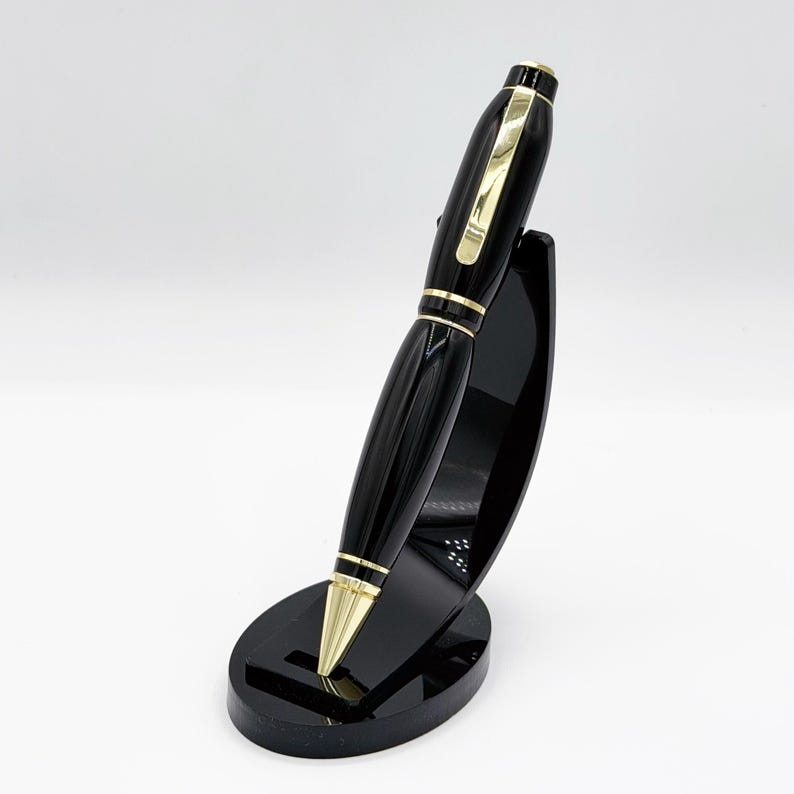 Black Resin Cigar Pen — glossy black with gold accents, executive desk pen