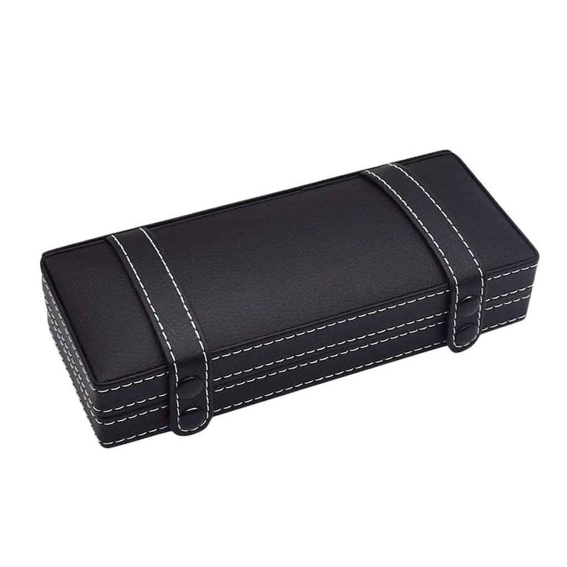 May include: A rectangular black box with white stitching and two white straps. The box has a leather-like texture and a clasp closure. The stitching is visible along the edges and straps, creating a decorative detail.