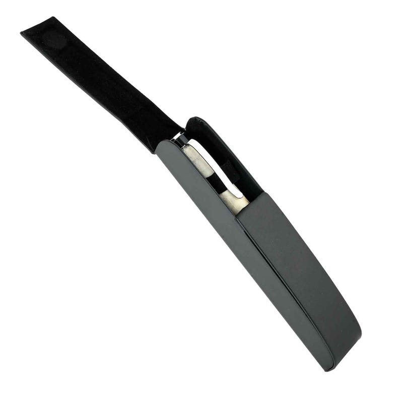 May include: A black, rectangular case with a matching strap and a silver object inside. The case is open, revealing the contents. The strap has a velcro closure.