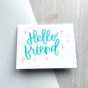 Tarjeta de saludo personalizada, sobre y mensaje escrito a mano. Incluye sello y envío.