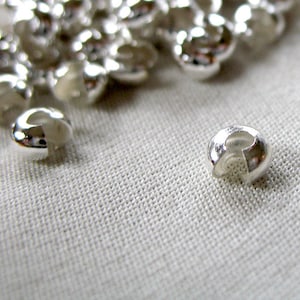 100 Crimp Covers; silver plated brass , 4mm diameter, pk of 100