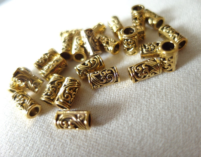 3mm hole pkg 25 25 gold plated scroll pattern tube beads 9mm long x 4mm wide