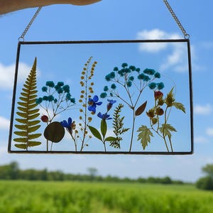 Ornate copper frame with real pressed flowers — elegant floral wall art, perfect birth flower gift or botanical home décor accent.