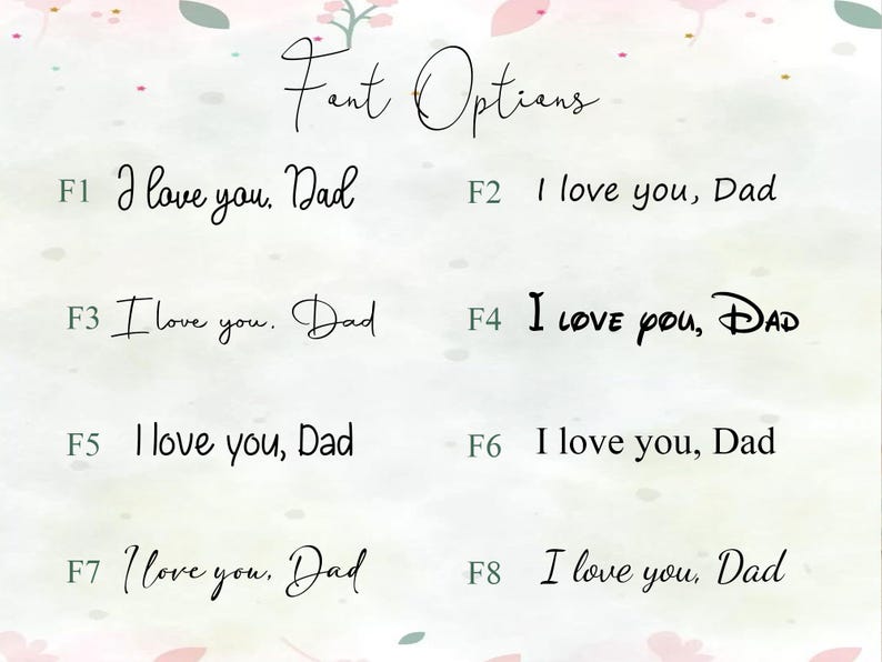 May include: Image showcasing eight font options for the phrase "I love you, Dad." The fonts vary in style, from elegant cursive to a bold, playful Disney-inspired font. The text is displayed on a soft, watercolor-like background with floral accents.