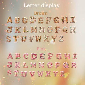 May include: A letter display featuring two complete sets of alphabet letters from A to Z. The top set is brown with white icing and festive decorations, labeled Brown. The bottom set is pink with white icing and festive decorations, labeled Pink.