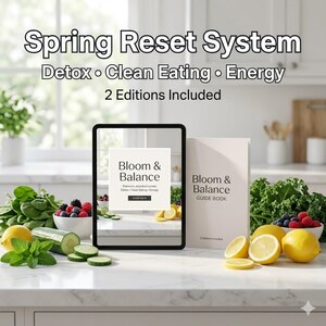 May include: An image promoting the "Spring Reset System" with the text "Detox, Clean Eating, Energy, 2 Editions Included." It features a tablet displaying "Bloom & Balance" and a guide book with the same title. Fresh produce, including lemons, berries, and greens, are arranged around the tablet and book.