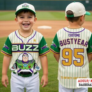 A young boy wearing a Buzz Lightyear baseball jersey and cap, smiling and posing on a baseball field.